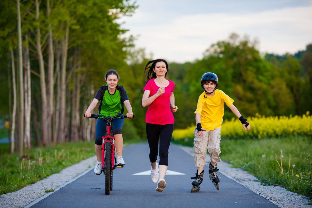 Mom exercising with her two children